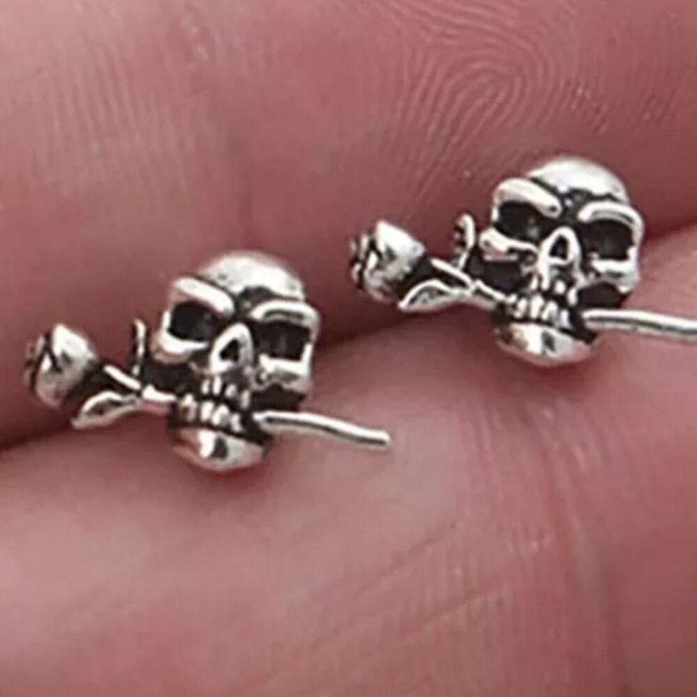 Skull biting rose post earrings
